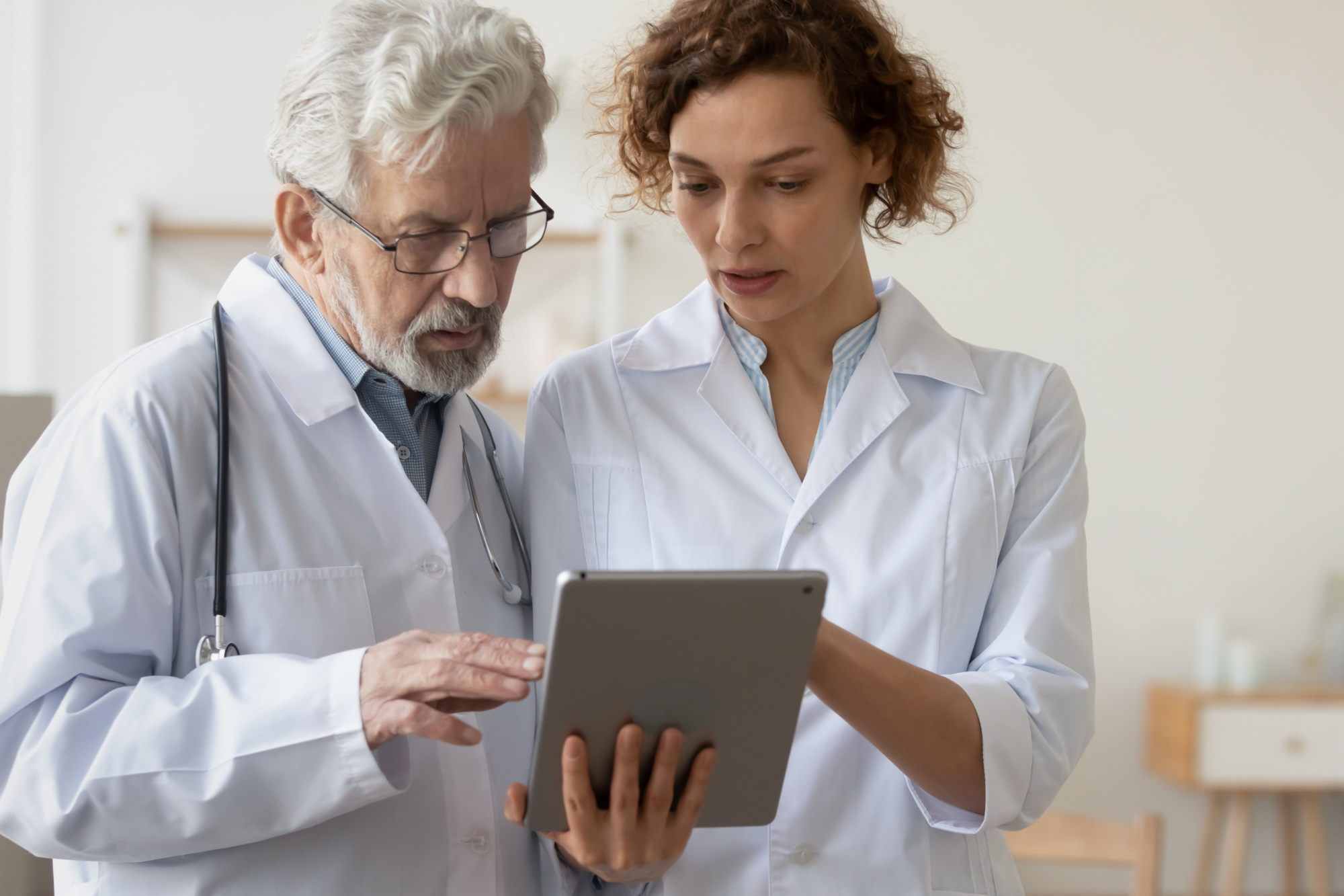 Physicians Sharing a Tablet